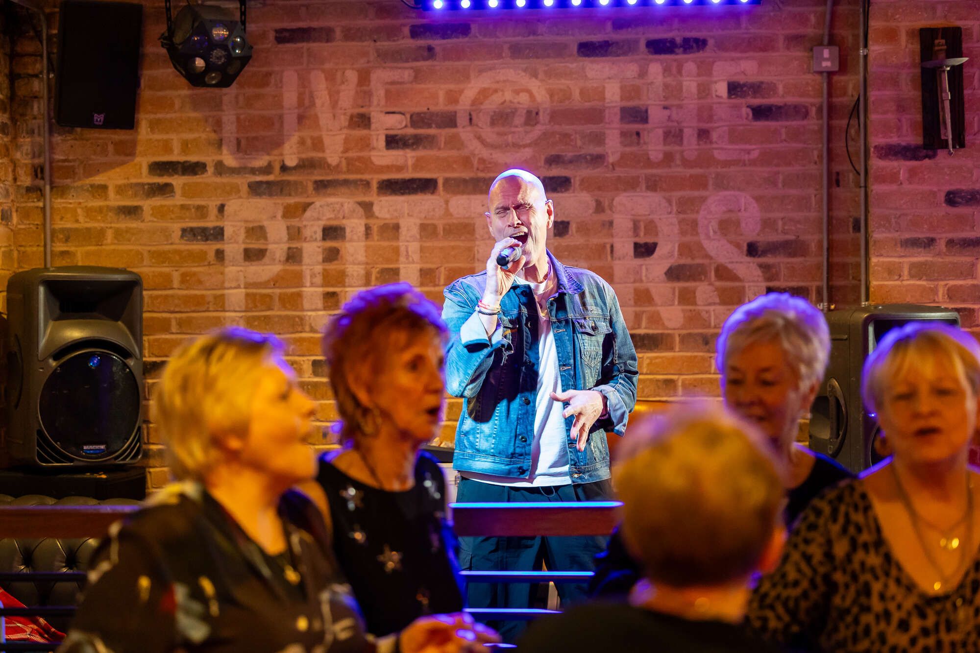 Singer with people on the dance floor