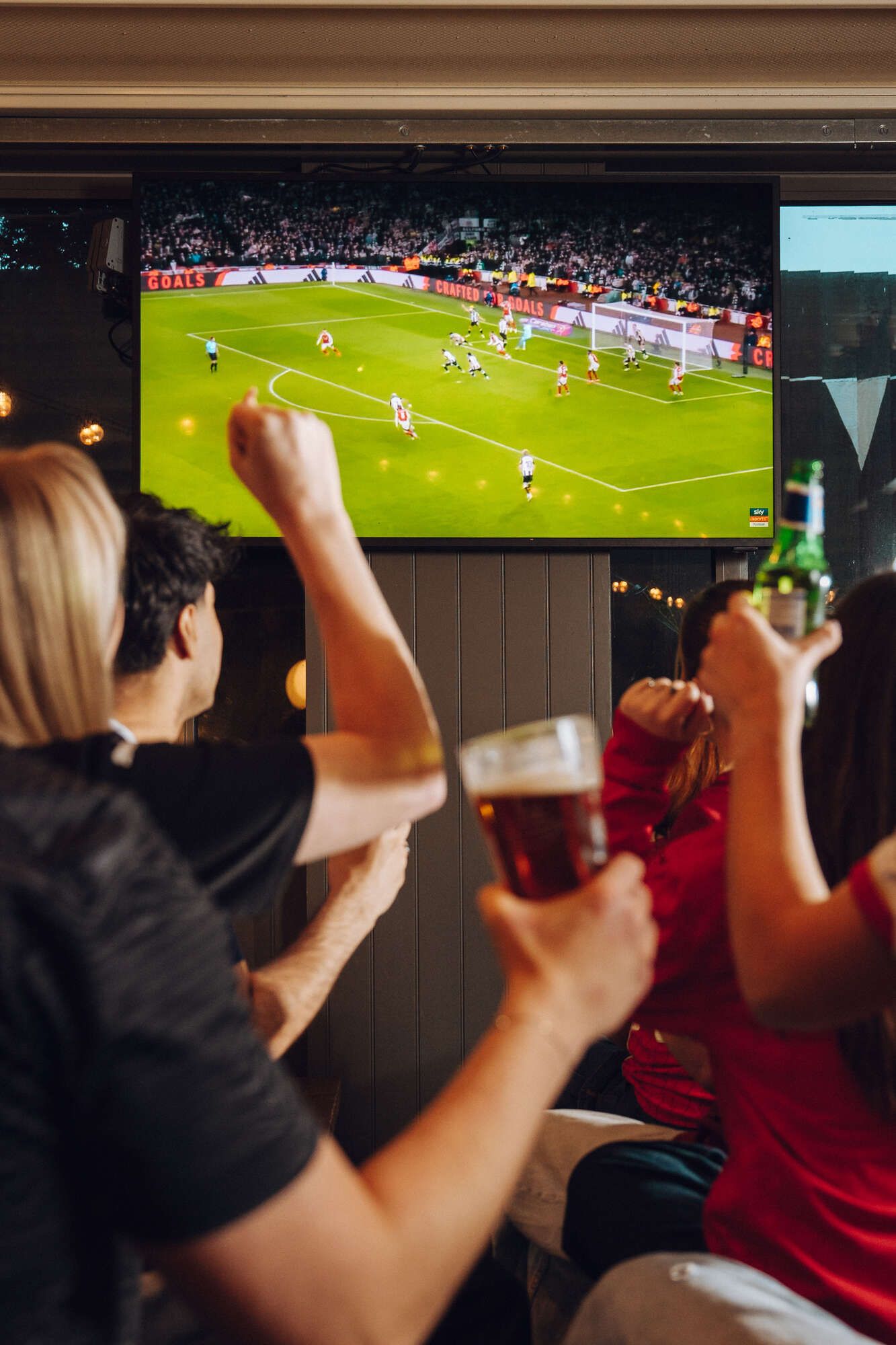 Watching football with friends and bottles/pints of beer